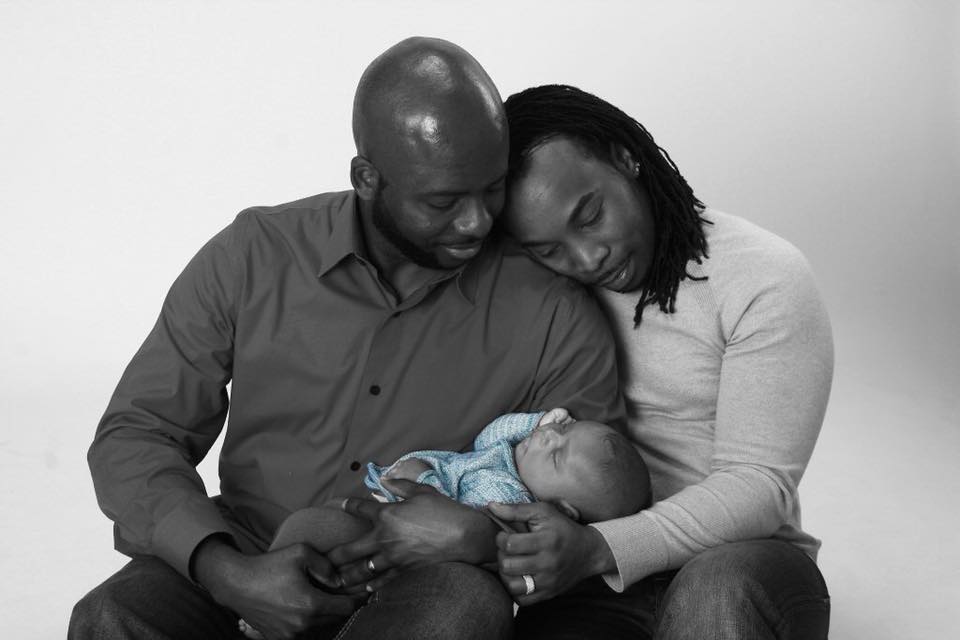 Kenan Cooper-Gilmore with his husband and child